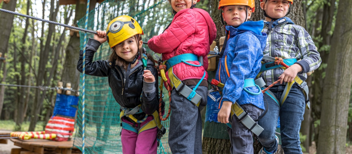 children-in-a-climbing-park-in-protective-helmets-2021-09-03-19-16-55-utc-min-min
